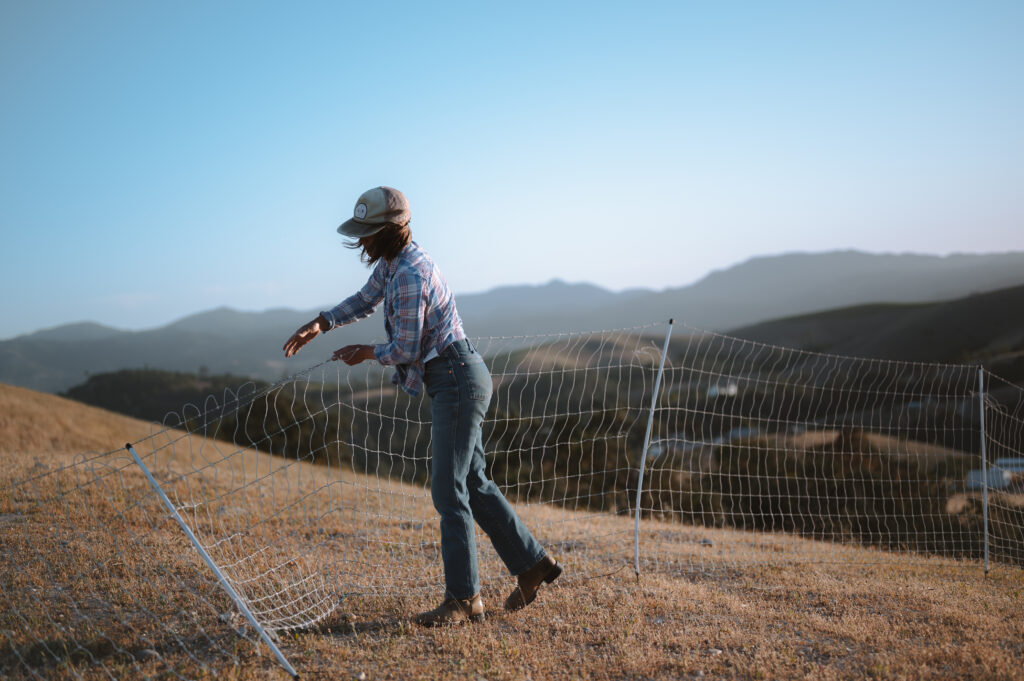 woman rancher moves fences on the land.